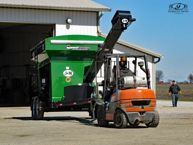 Moving seed tender at Gingerich Farms