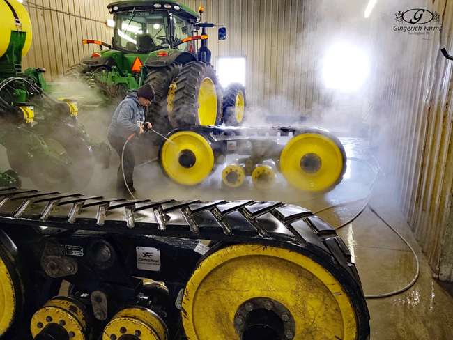 Washing trax at Gingerich Farms