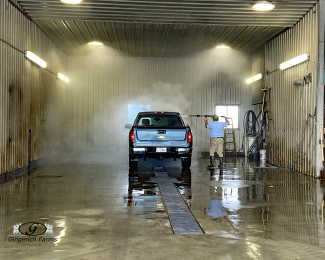 Cleaning truck at Gingerich Farms